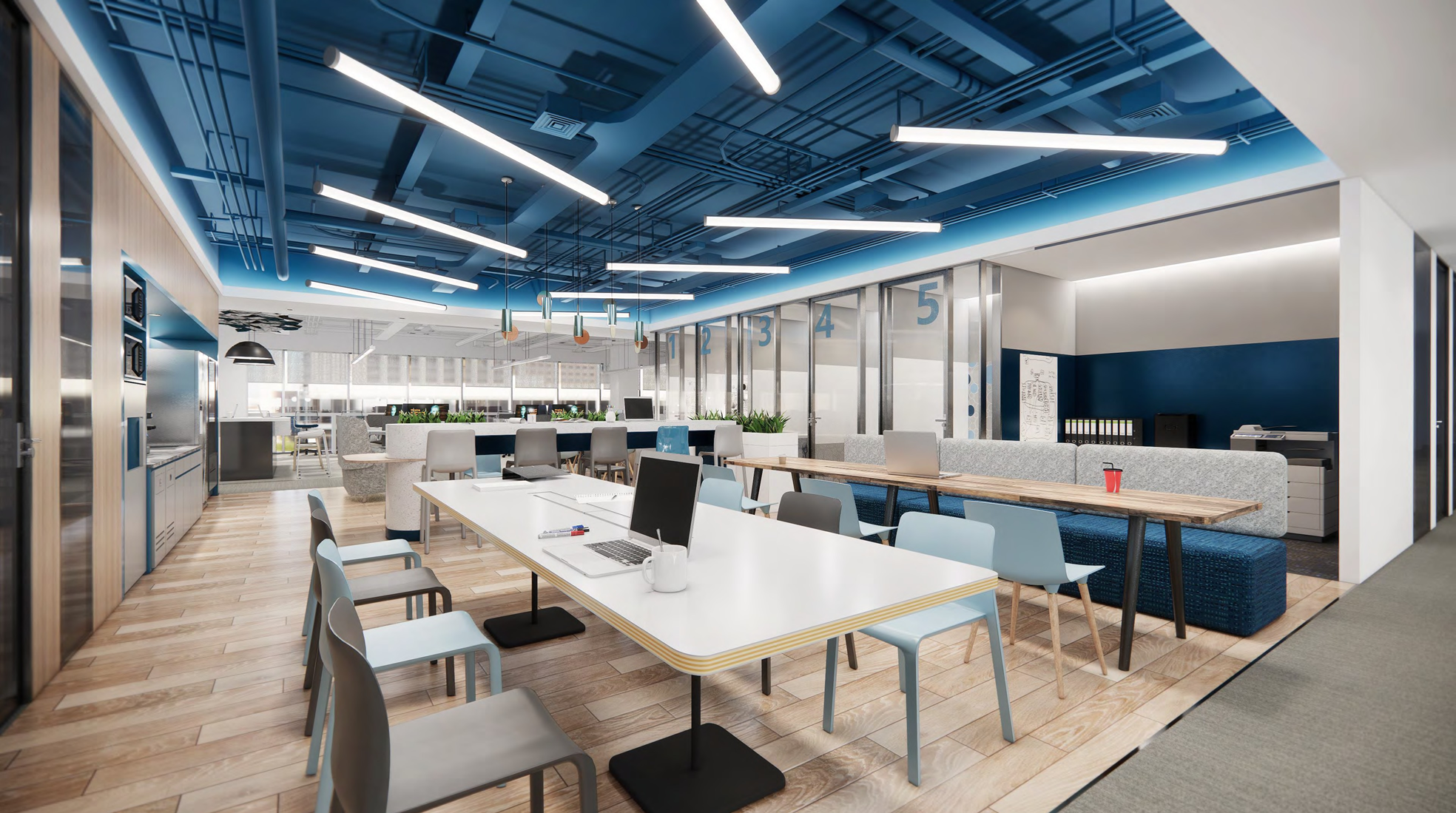 Open workplace with a blue exposed-services ceiling