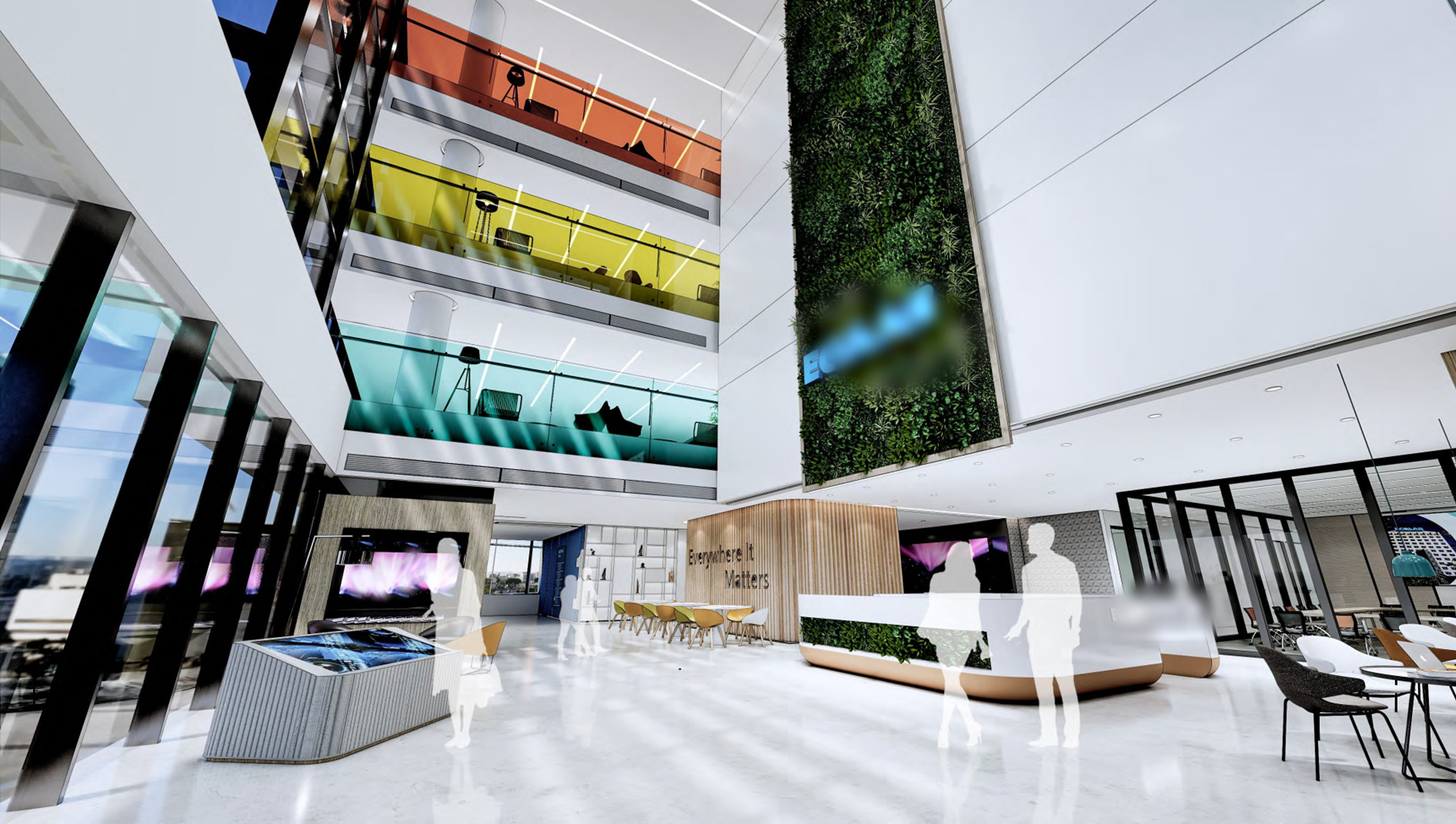 Tall atrium with a living wall and colorful collaboration balconies